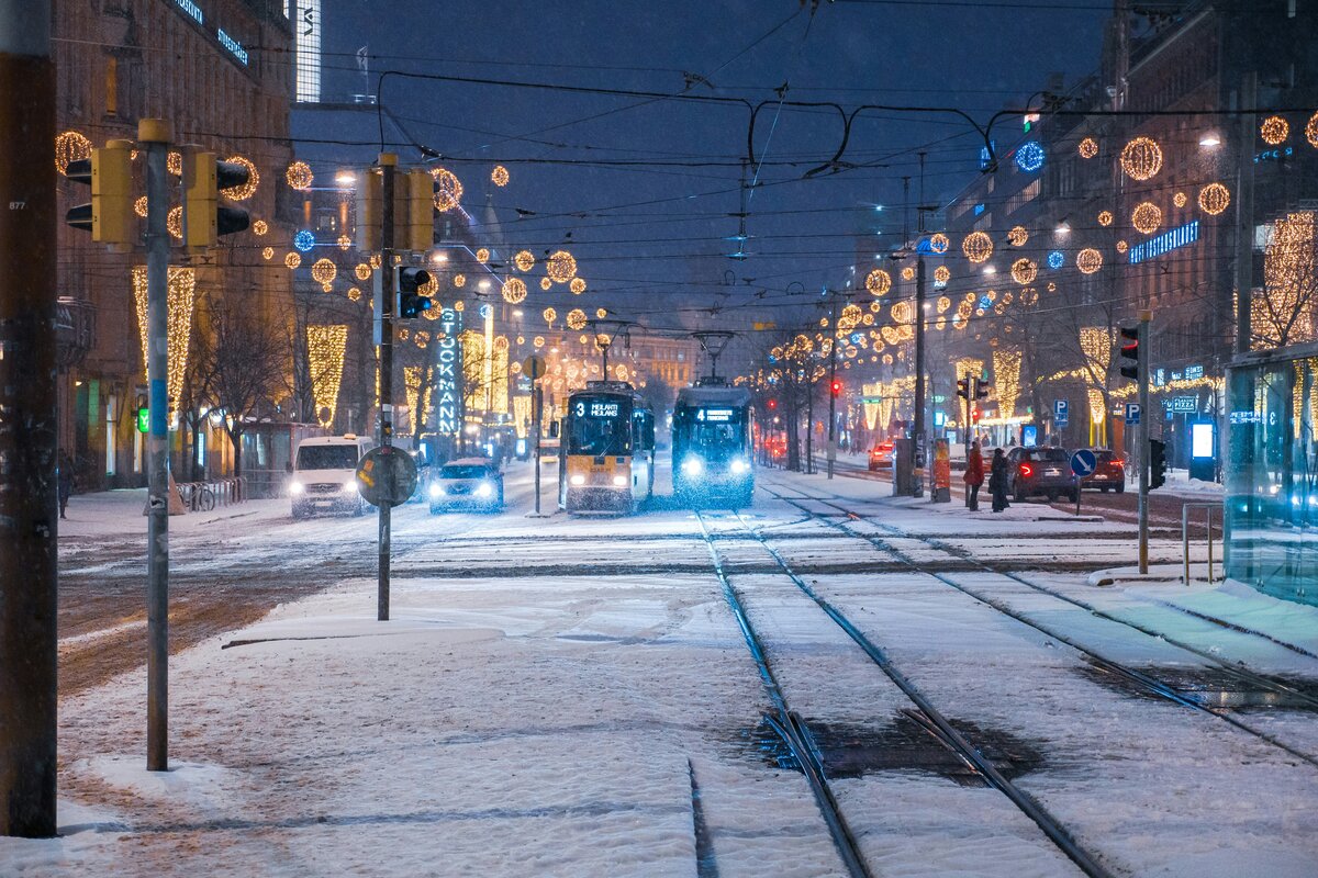 Snow-covered street in Helsinki at dusk